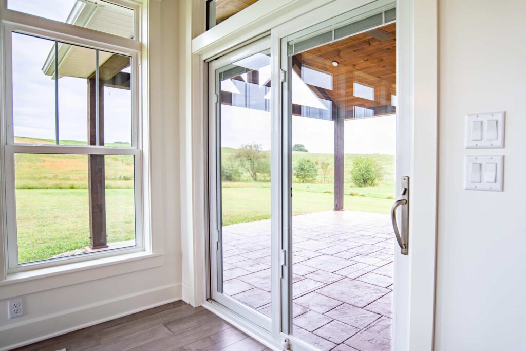 White sliding door with decorative interior handle. 